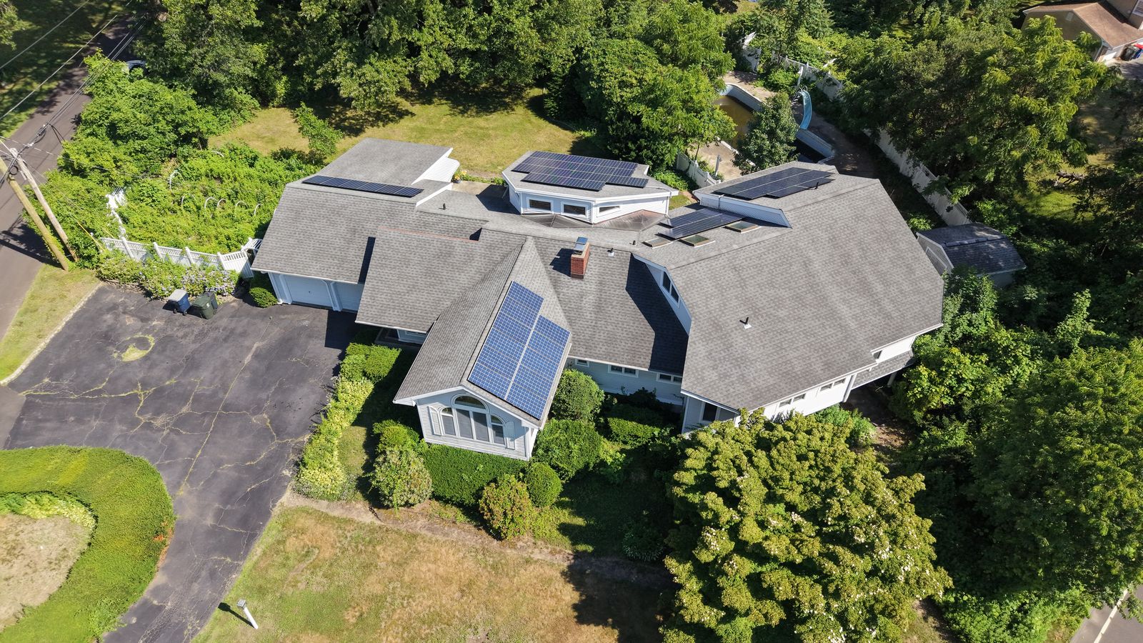 Top-down aerial showing the 15.34 kW rooftop solar array