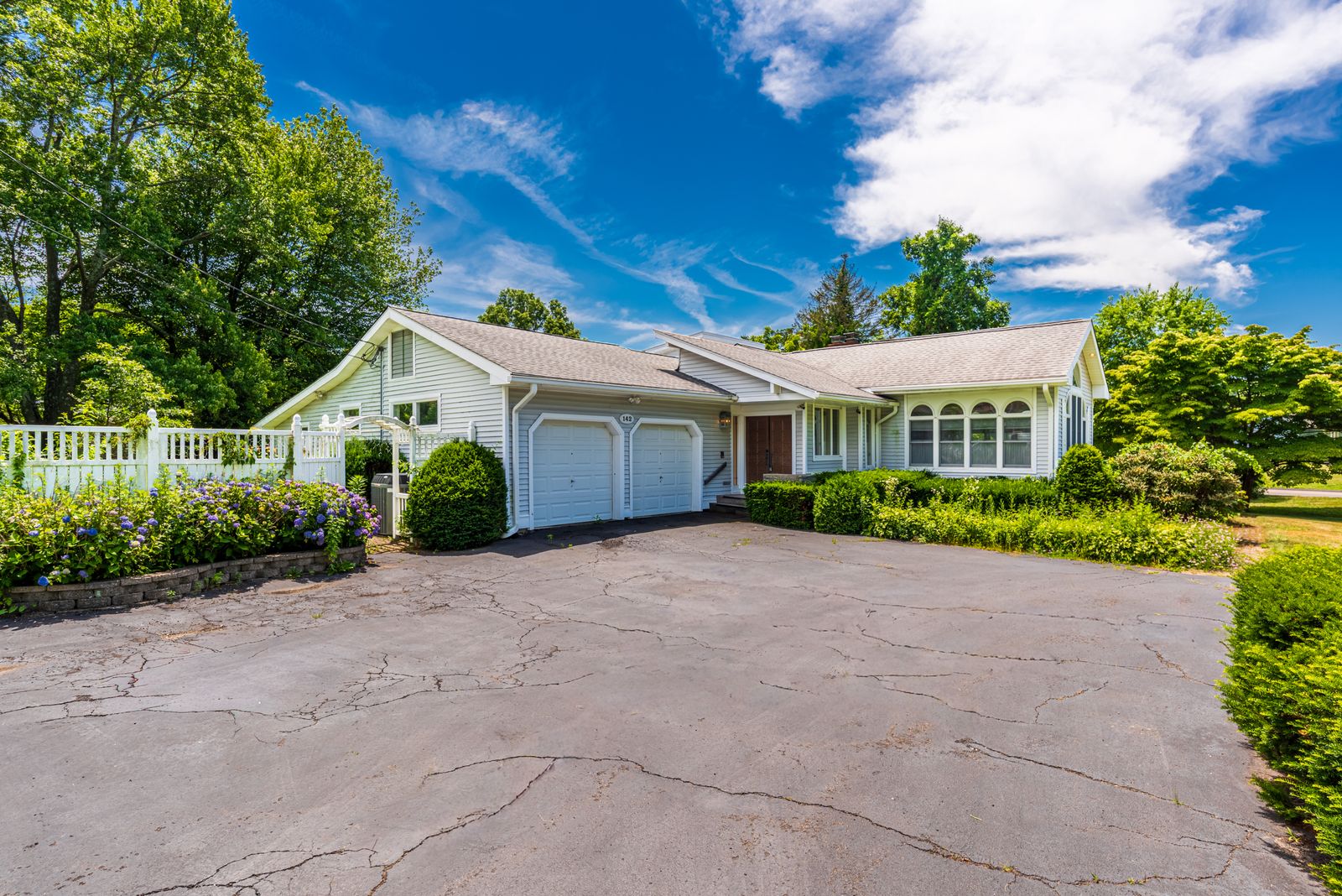 Circular paved driveway approach to the home