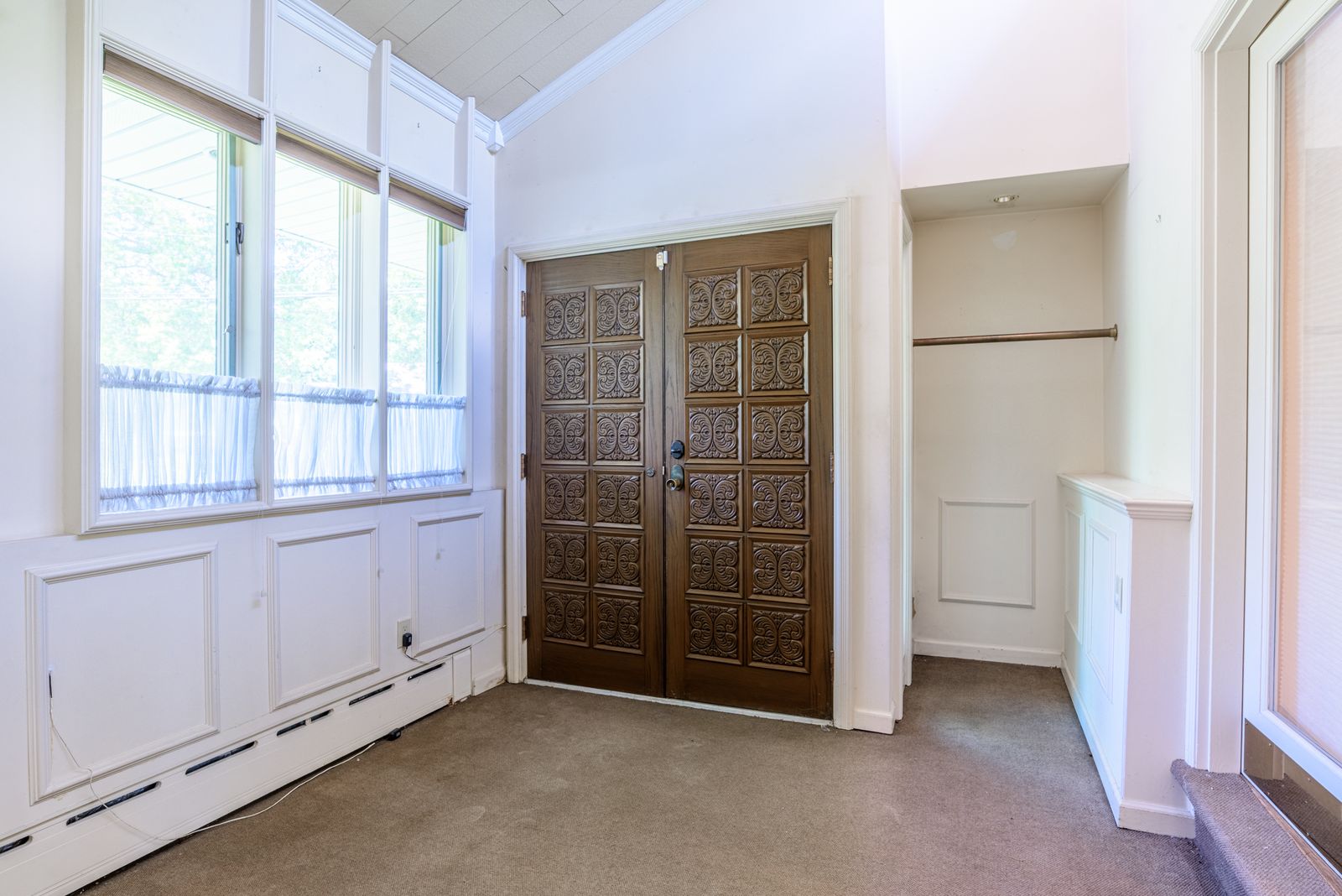 Foyer entry with wood double doors