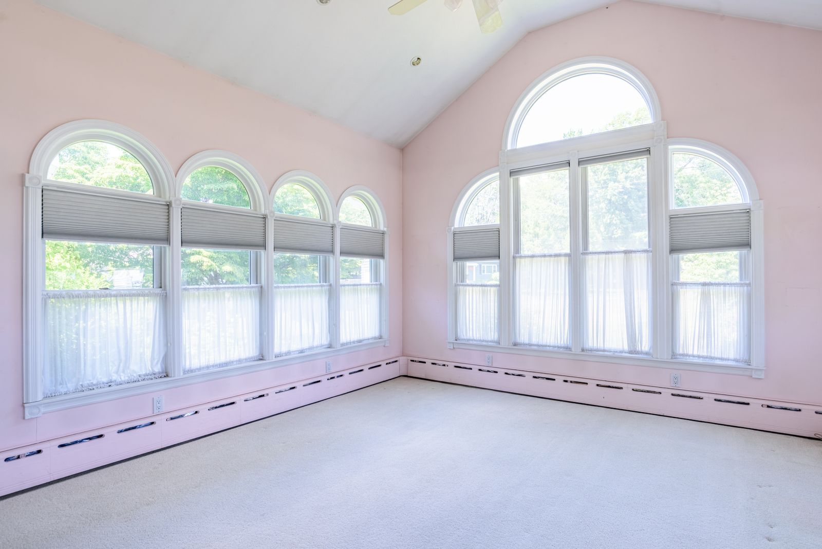 Vaulted great room with arched windows