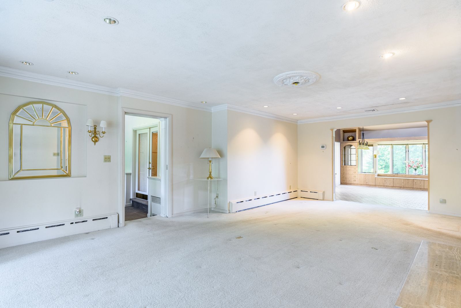 Fireplaced living room with wall of windows
