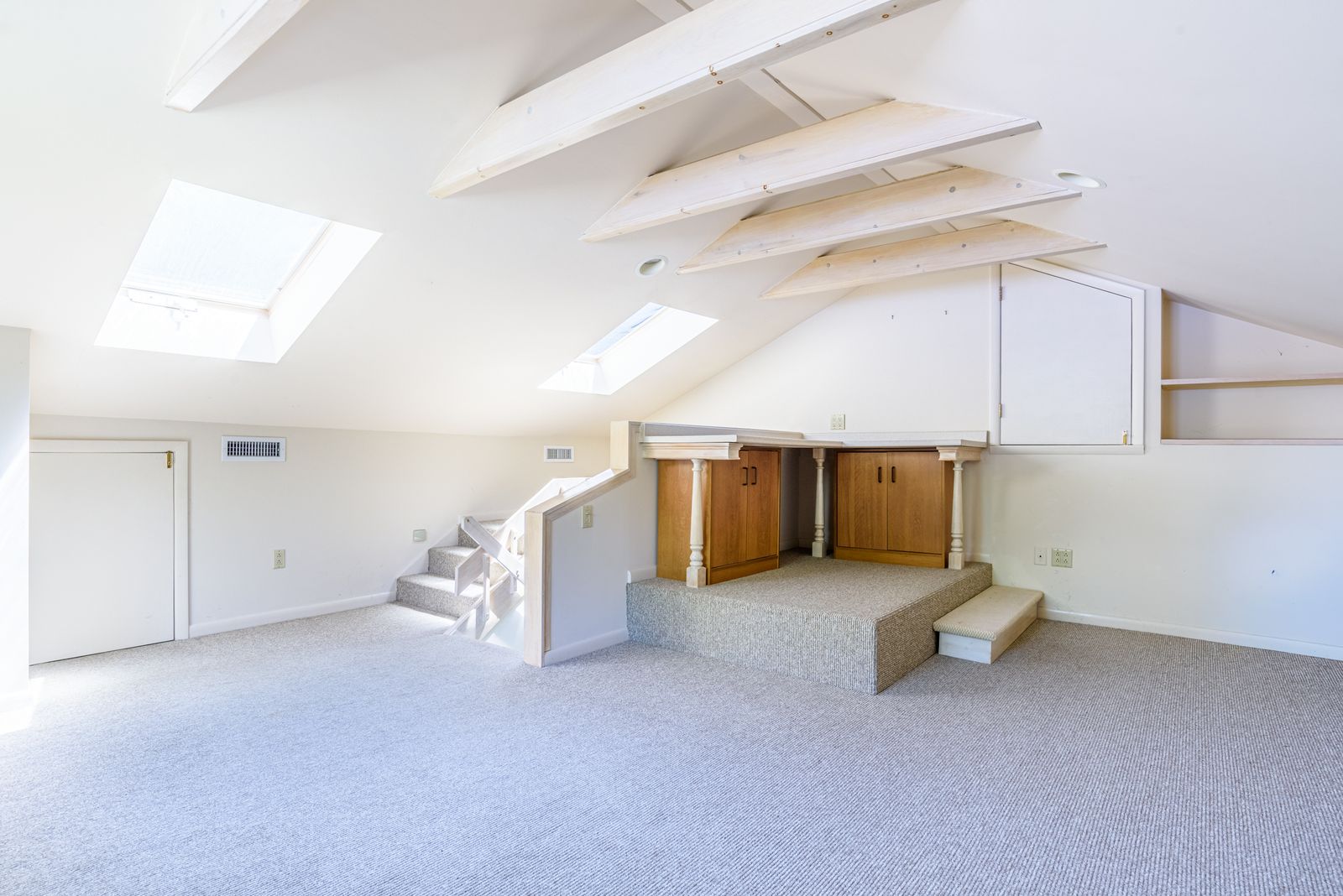 Loft craft room under cathedral ceiling