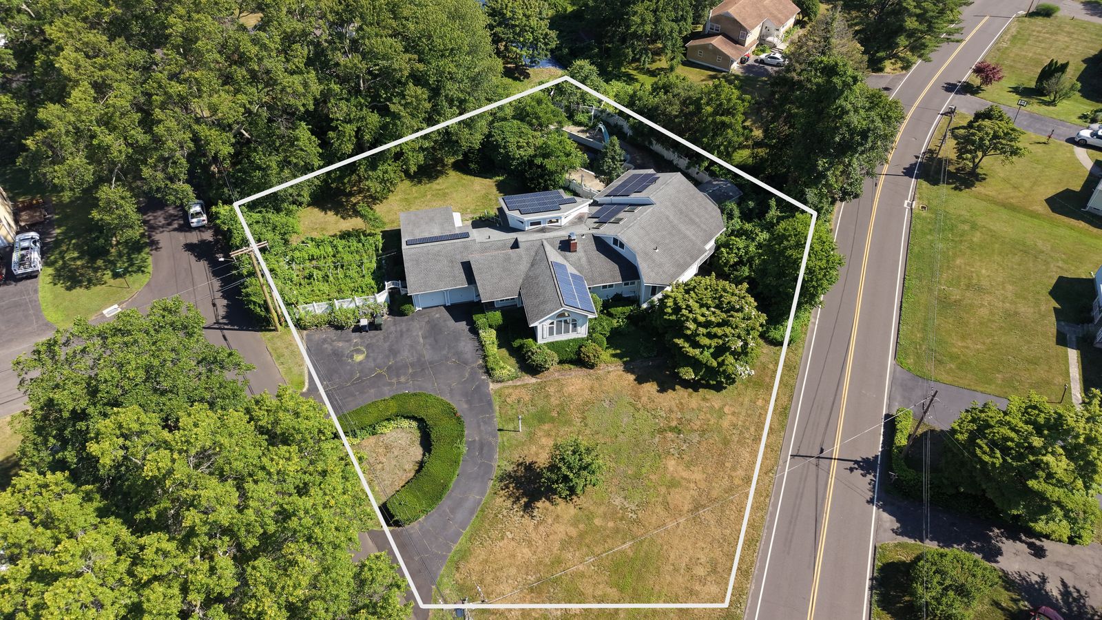Aerial view with parcel outline of the 0.67 acre lot