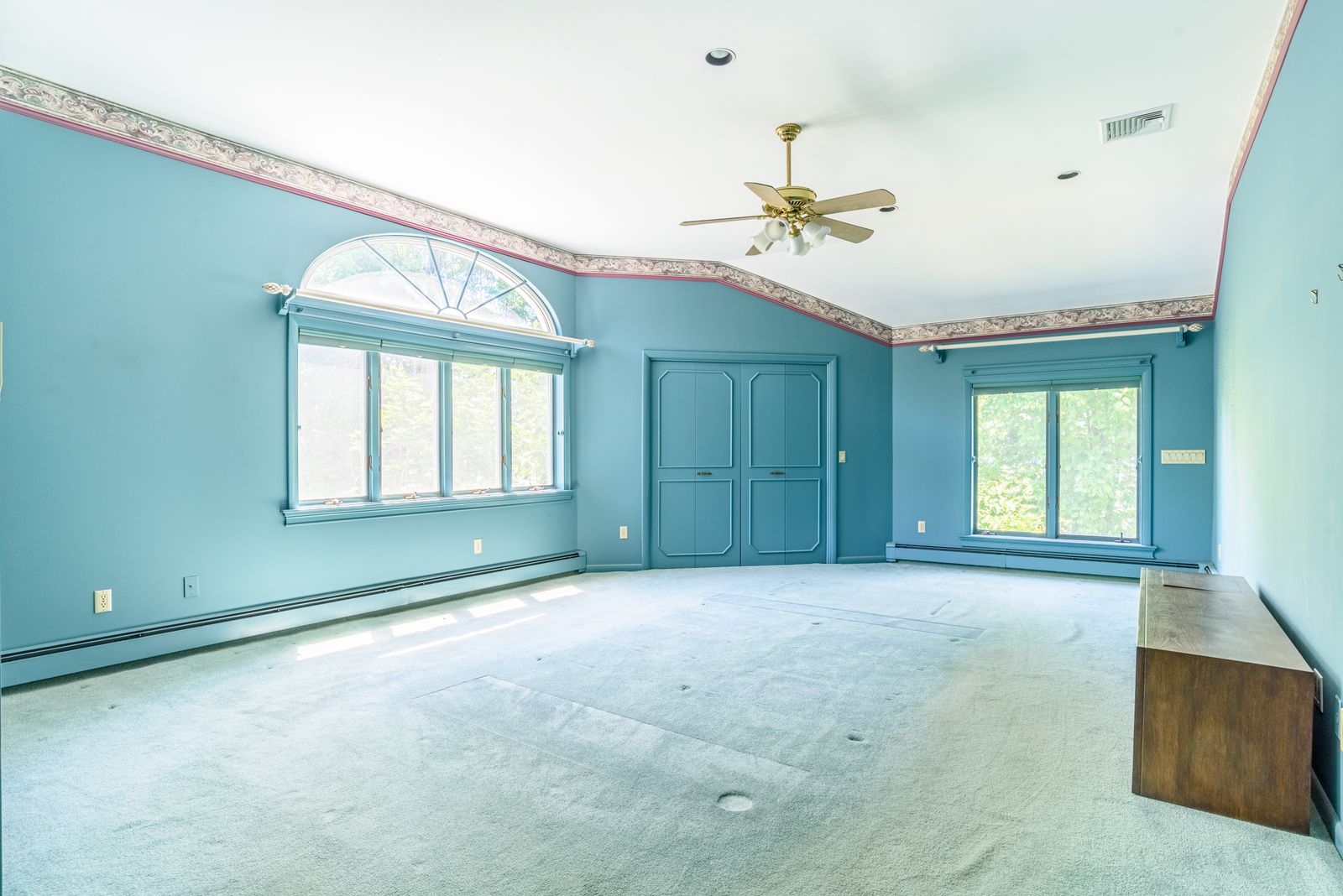 Primary bedroom suite with bay window