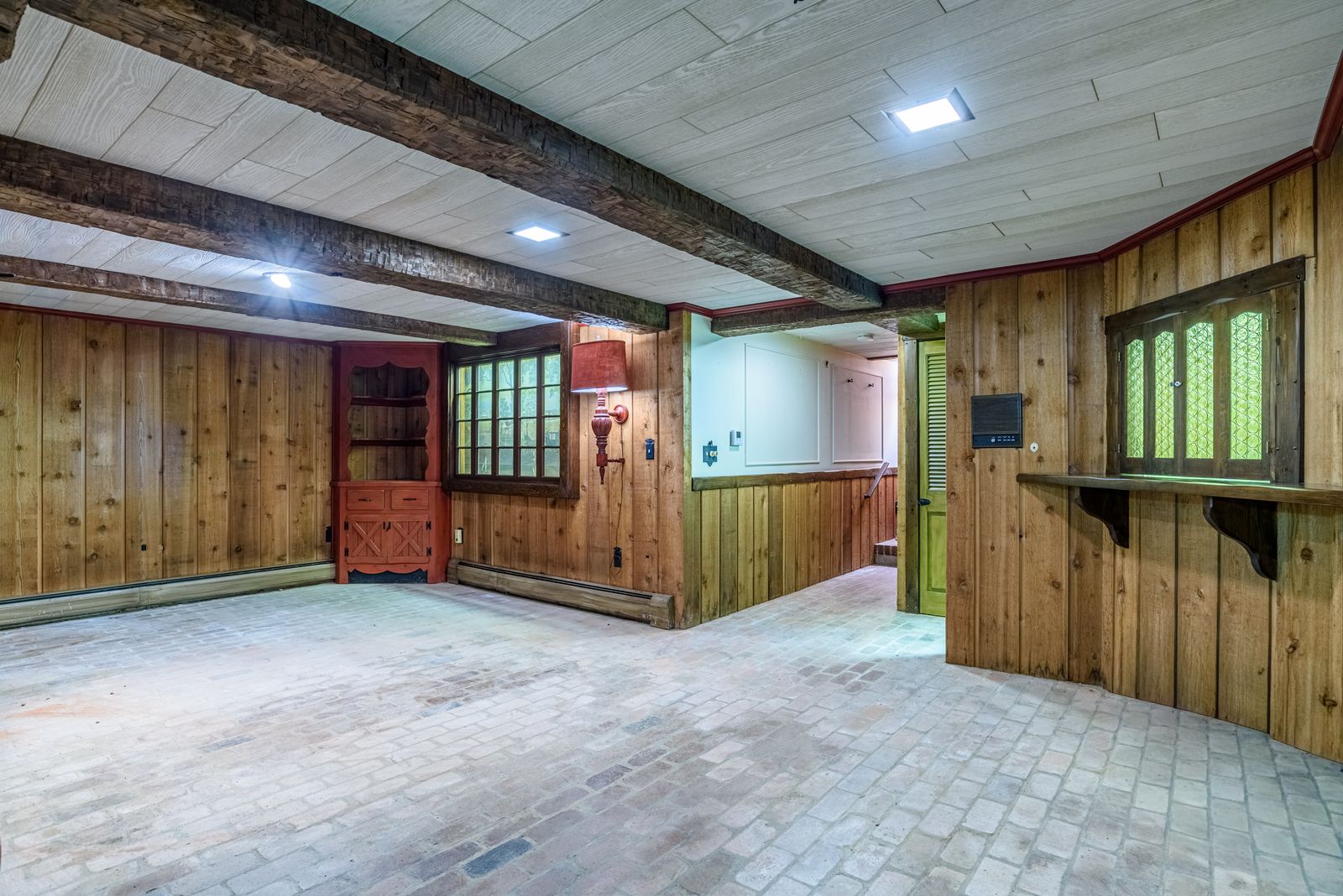Wood-paneled lower-level recreation room